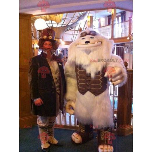 Mascot monstruo blanco yeti blanco con un traje marrón -