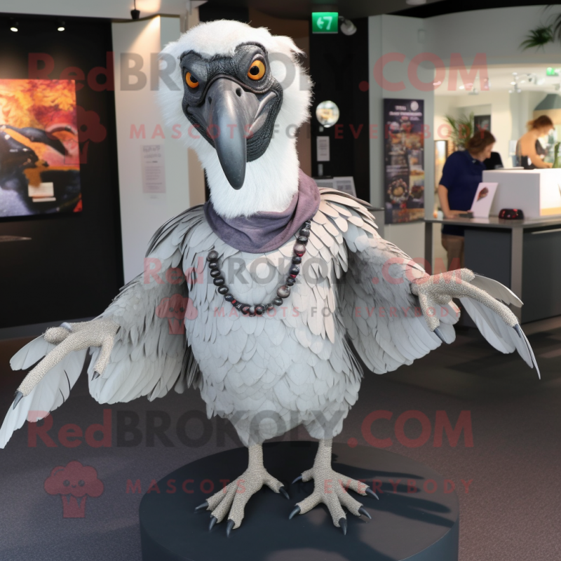 Silver Vulture mascot costume character dressed with a Button-Up Shirt and Shawl pins Silver Vulture mascot costume character dressed with a Button-Up Shirt and Shawl pins