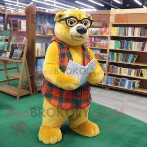Yellow Sea Lion mascot costume character dressed with a Flannel Shirt and Reading glasses