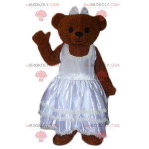 Braunes Teddy-Maskottchen in einem Hochzeitskleid -