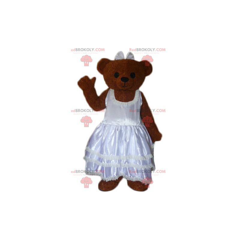 Braunes Teddy-Maskottchen in einem Hochzeitskleid -