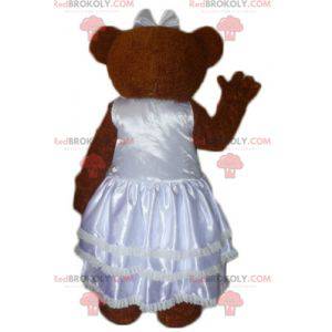 Mascota de peluche marrón vestida con un vestido de novia -