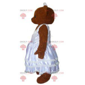 Mascota de peluche marrón vestida con un vestido de novia -