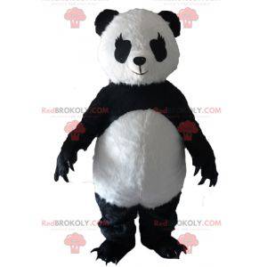 Mascotte del panda in bianco e nero con grandi artigli -