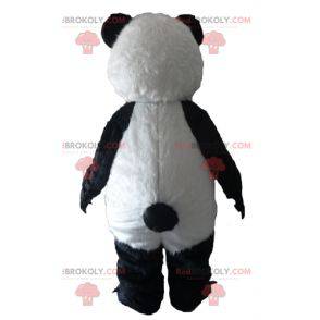 Mascotte de panda noir et blanc avec de grandes griffes -