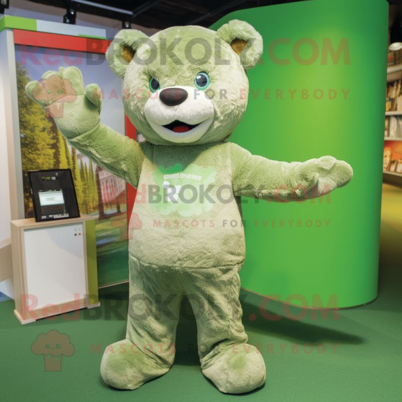 Olive Teddy Bear mascot costume character dressed with a T-Shirt and Lapel pins Olive Teddy Bear mascot costume character dressed with a T-Shirt and Lapel pins