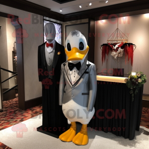 Silver Duck mascot costume character dressed with a Tuxedo and Scarves