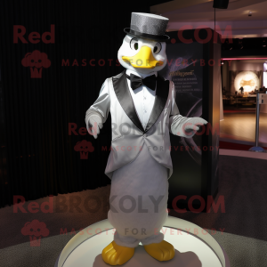 Silver Duck mascot costume character dressed with a Tuxedo and Scarves