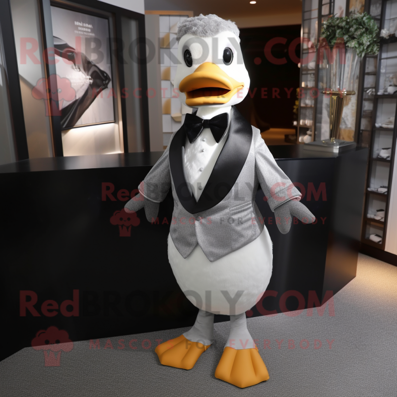 Silver Duck mascot costume character dressed with a Tuxedo and Scarves