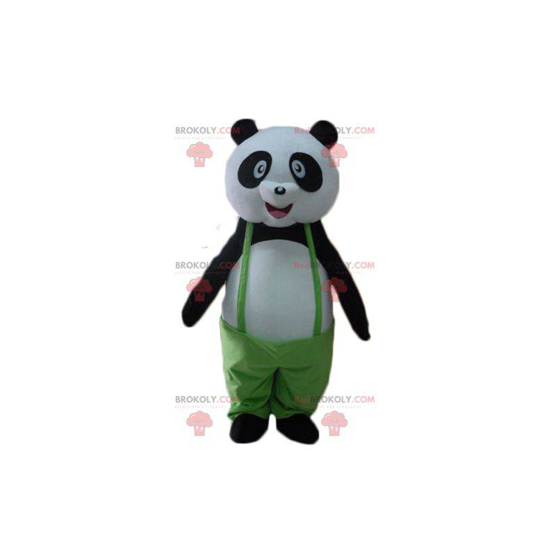 Czarno-biała maskotka panda z zielonym kombinezonem -