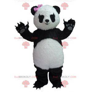 Mascotte de panda noir et blanc avec un nœud rose -