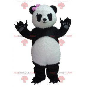 Mascotte de panda noir et blanc avec un nœud rose -