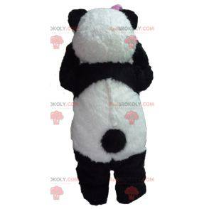 Mascotte de panda noir et blanc avec un nœud rose -