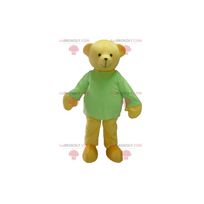 Mascote do ursinho de pelúcia amarelo com uma camiseta verde -