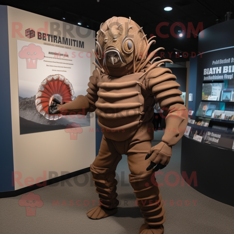 Brown Trilobite mascot costume character dressed with a Rash Guard and Cummerbunds