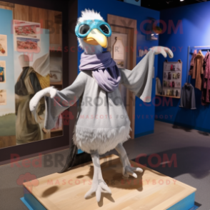 Silver Dodo Bird mascot costume character dressed with a Flare Jeans and Scarves