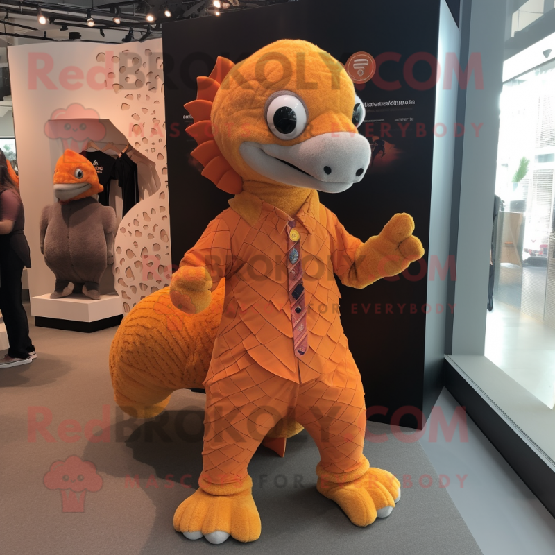 Orange Pangolin mascot costume character dressed with a Dress Shirt and Shoe laces