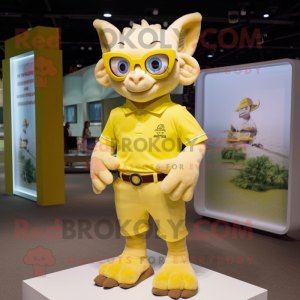 Yellow Gargoyle mascot costume character dressed with a Polo Shirt and Eyeglasses