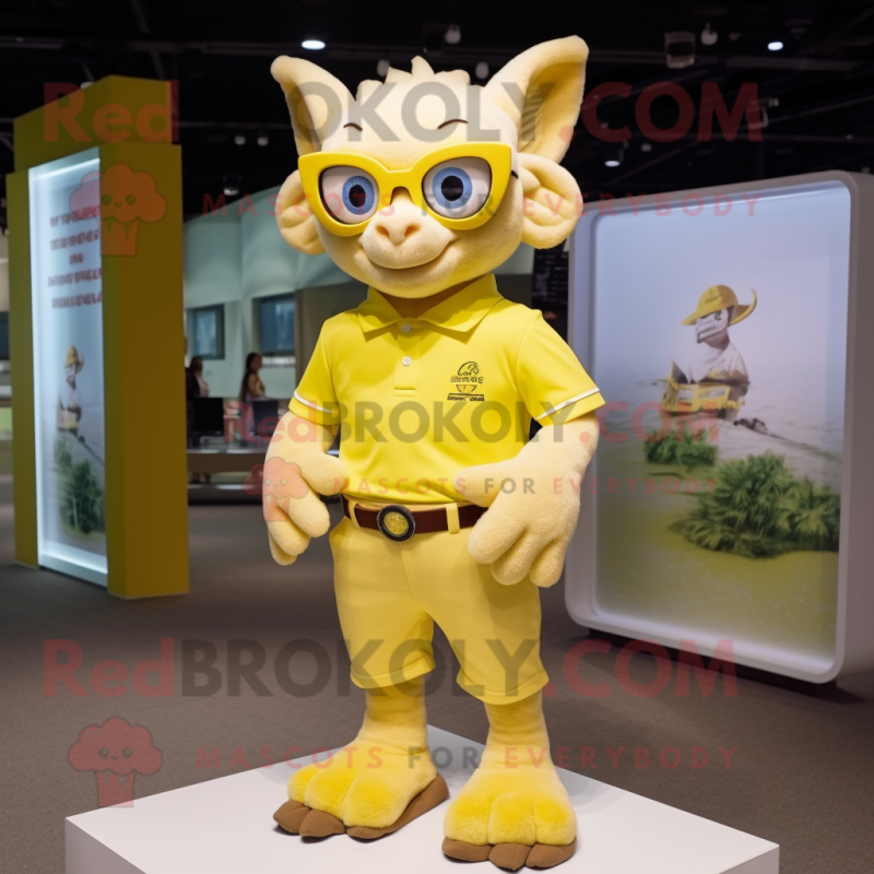 Yellow Gargoyle mascot costume character dressed with a Polo Shirt and Eyeglasses Yellow Gargoyle mascot costume character dressed with a Polo Shirt and Eyeglasses