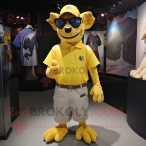 Yellow Gargoyle mascot costume character dressed with a Polo Shirt and Eyeglasses