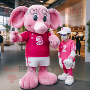 Pink Elephant mascot costume character dressed with a Rugby Shirt and Smartwatches