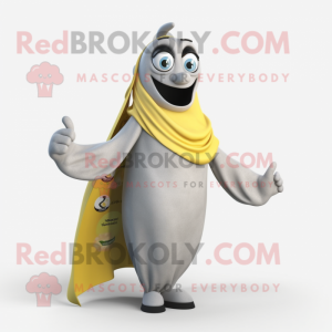 Gray Banana mascot costume character dressed with a T-Shirt and Shawl pins