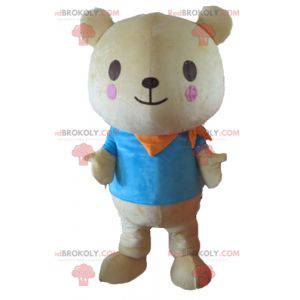 Big beige teddy bear mascot with a blue t-shirt - Redbrokoly.com