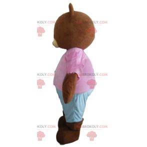 Liten brun bjørn maskot brun med rosa og blå antrekk -