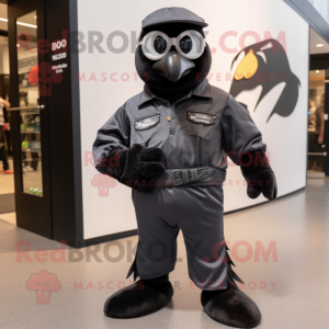 Black Dove mascot costume character dressed with a Moto Jacket and Foot pads