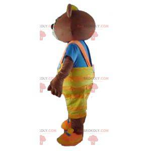 Brown bear mascot with yellow overalls and a t-shirt -