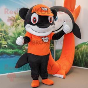 Orange Killer Whale mascot costume character dressed with a Bermuda Shorts and Cummerbunds