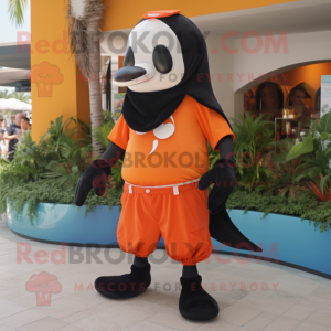 Orange Killer Whale mascot costume character dressed with a Bermuda Shorts and Cummerbunds