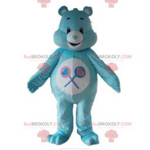 Mascota de oso de cuidado azul y blanco con piruletas -