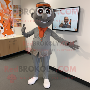 Gray Tikka Masala mascot costume character dressed with a Dress Pants and Ties