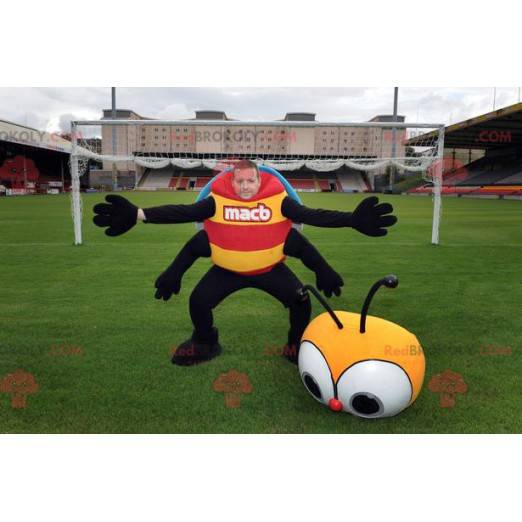 Coccinella insetto mascotte giallo rosso blu e nero -