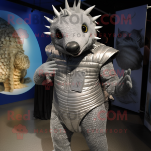 Silver Armadillo mascot costume character dressed with a Jeggings and Hairpins