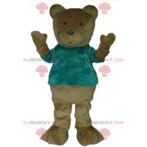 Mascotte marrone dell'orsacchiotto con una maglietta verde -