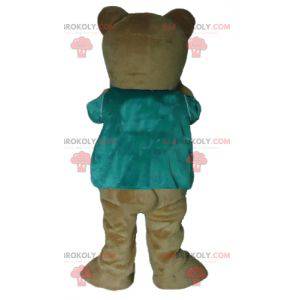 Mascote do ursinho de pelúcia marrom com uma camiseta verde -
