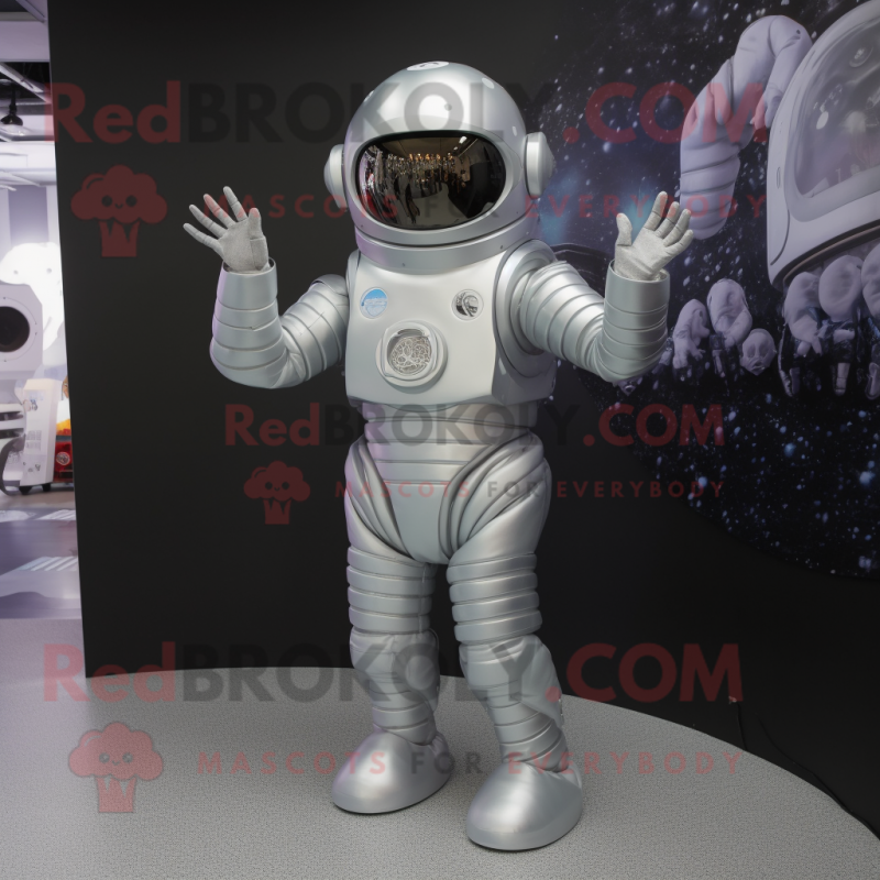 Silver Astronaut mascot costume character dressed with a A-Line Skirt and Mittens Silver Astronaut mascot costume character dressed with a A-Line Skirt and Mittens