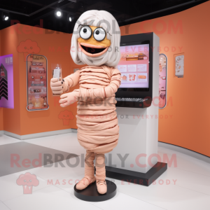 Peach Mummy mascot costume character dressed with a Pencil Skirt and Digital watches