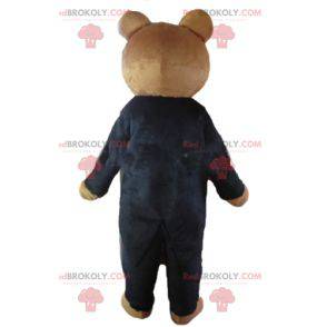 Brown teddy bear mascot dressed in a black costume -