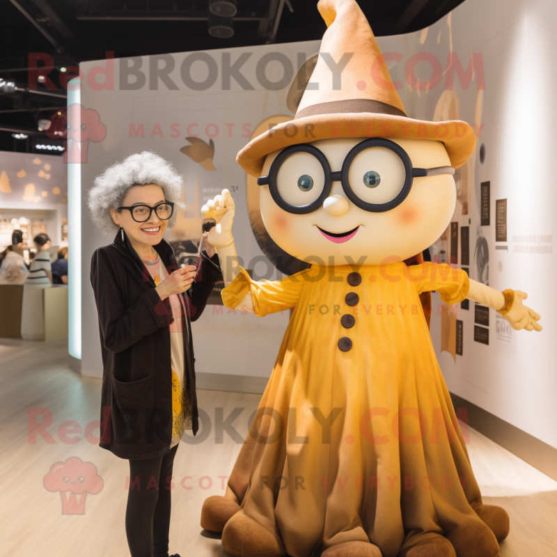 Gold Witch mascot costume character dressed with a Oxford Shirt and Eyeglasses