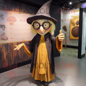 Gold Witch mascot costume character dressed with a Oxford Shirt and Eyeglasses