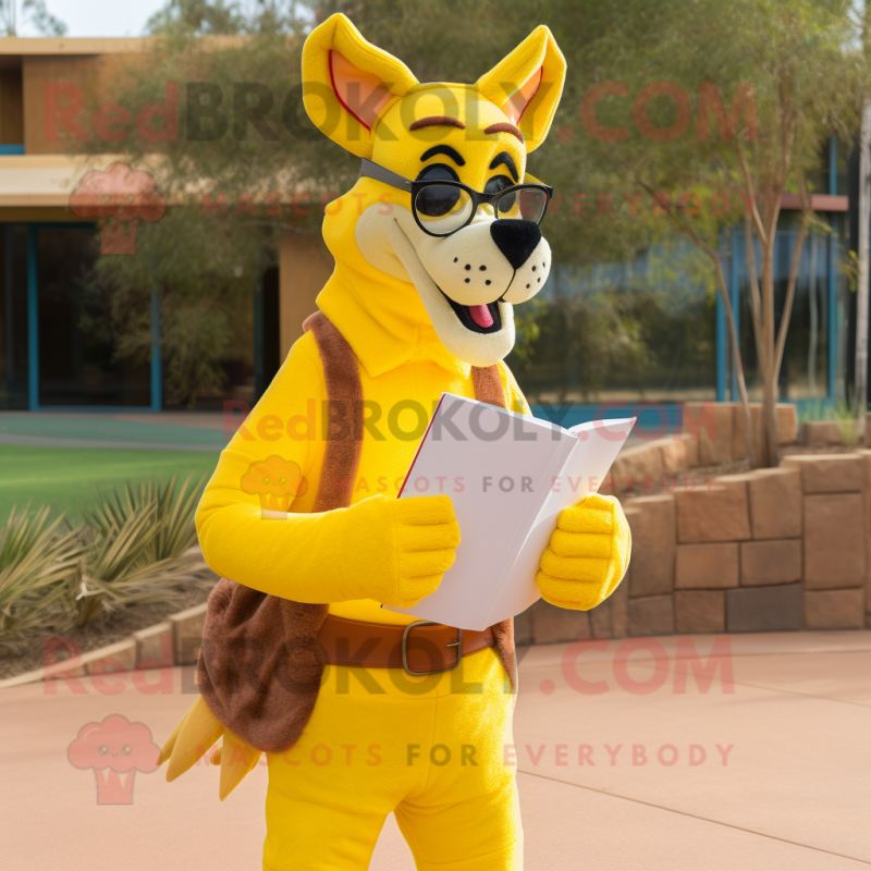 Yellow Dingo mascot costume character dressed with a Boyfriend Jeans and Reading glasses