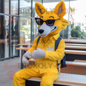 Yellow Dingo mascot costume character dressed with a Boyfriend Jeans and Reading glasses