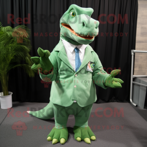 Green T Rex mascot costume character dressed with a Poplin Shirt and Tie pins