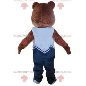 Brown and beige teddy bear mascot in blue outfit -