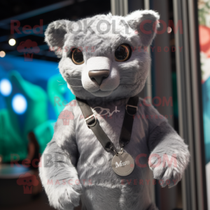 Silver Jaguarundi mascot costume character dressed with a Polo Tee and Keychains