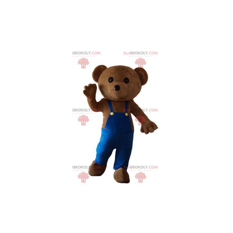 Mascotte d'ours en peluche avec une salopette bleue -