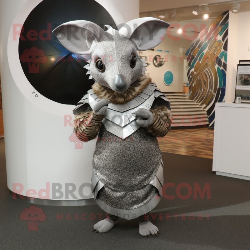 Silver Armadillo mascot costume character dressed with a Wrap Dress and Rings